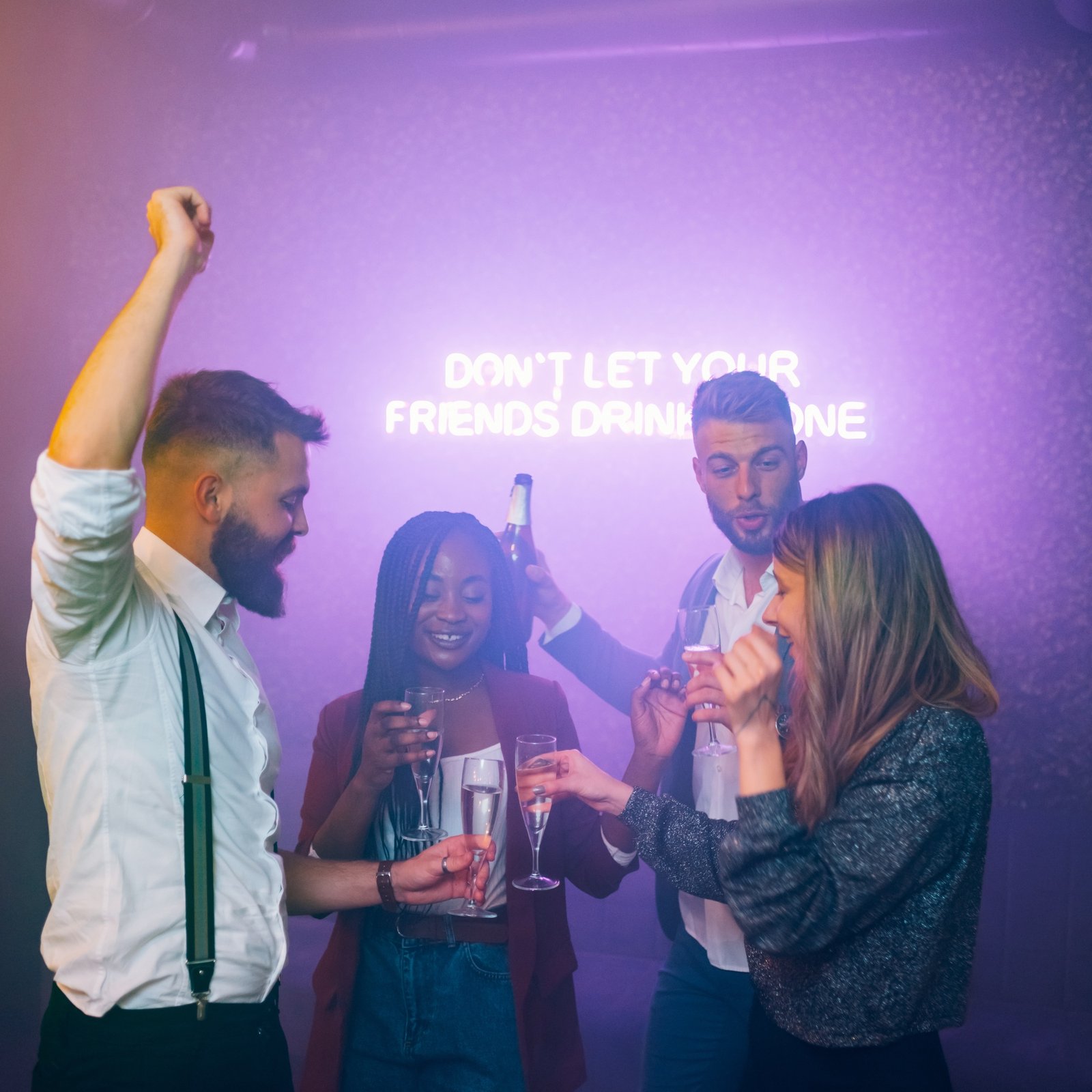 friends-dancing-on-a-party-in-a-club-while-drinking-champagne.jpg